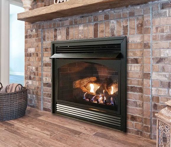 Vent-free gas fireplace in a brick surround