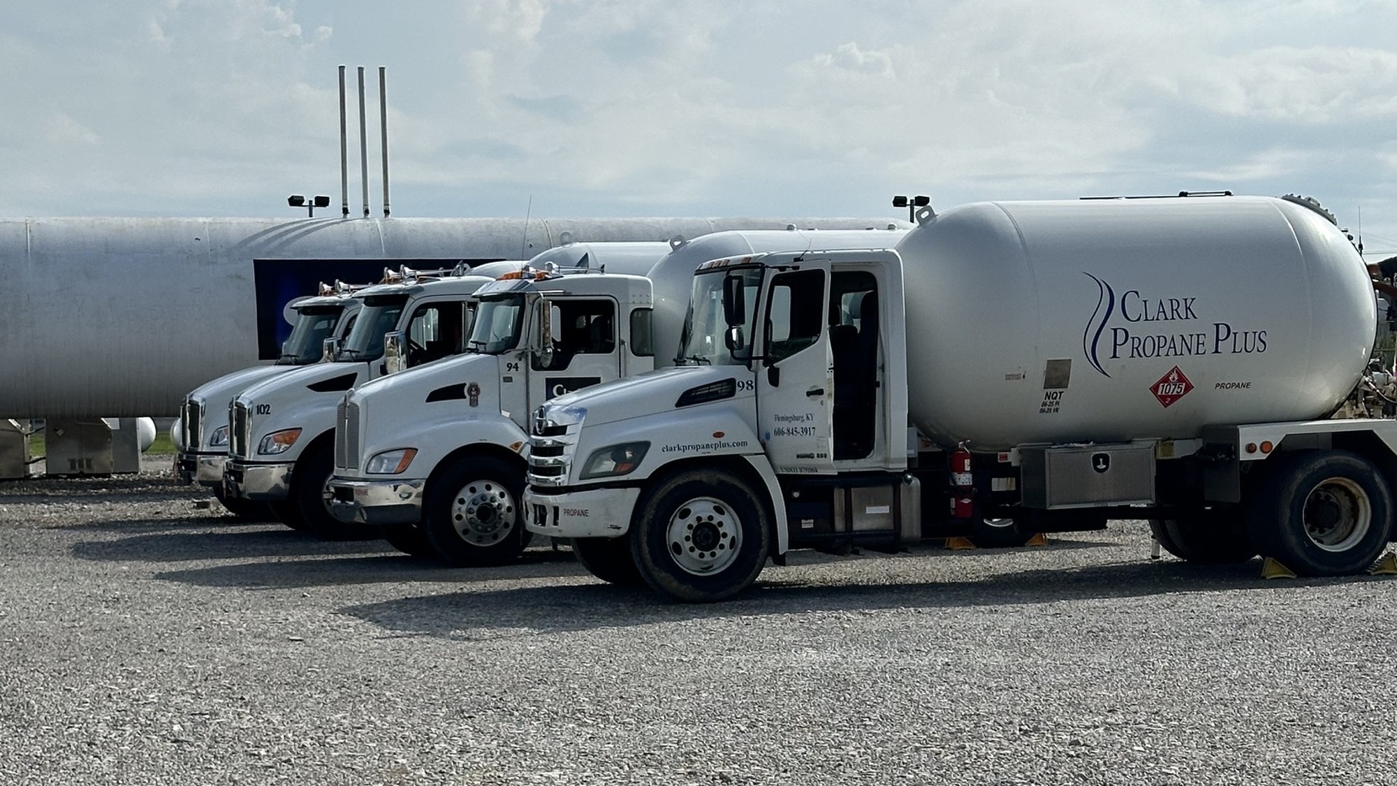 Clark Propane Plus delivery truck fleet lined up in Central Kentucky — reliable propane delivery